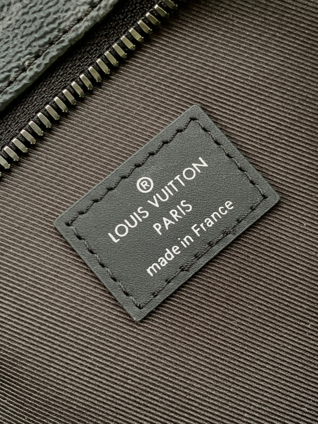 Louis Vuitton monogram bag Made in France logo leather label