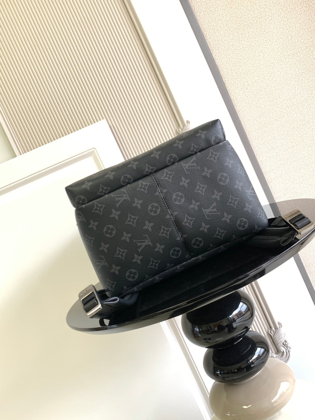 Louis Vuitton monogram backpack front view with top zipper and black trim