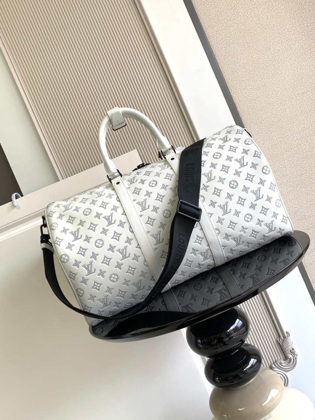 Louis Vuitton monogram duffel bag, white with black crossbody strap and curved base
