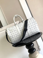 Louis Vuitton monogram duffel bag, white with black crossbody strap and curved base