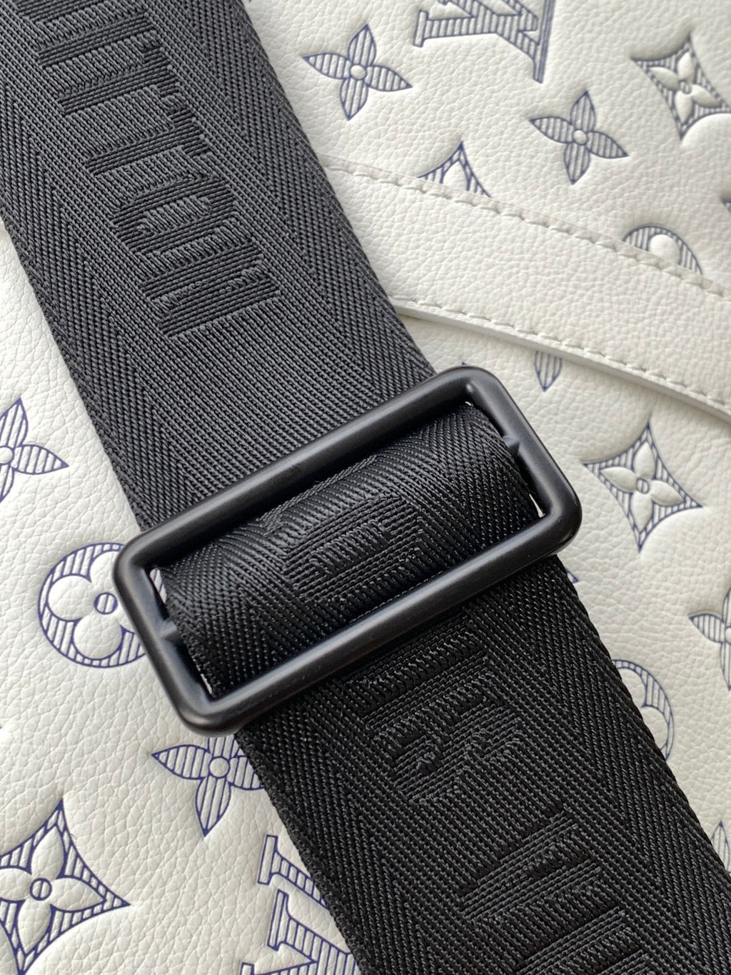 Louis Vuitton monogram bag strap, black textured webbing with embossed pattern