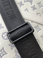 Louis Vuitton monogram bag strap, black textured webbing with embossed pattern