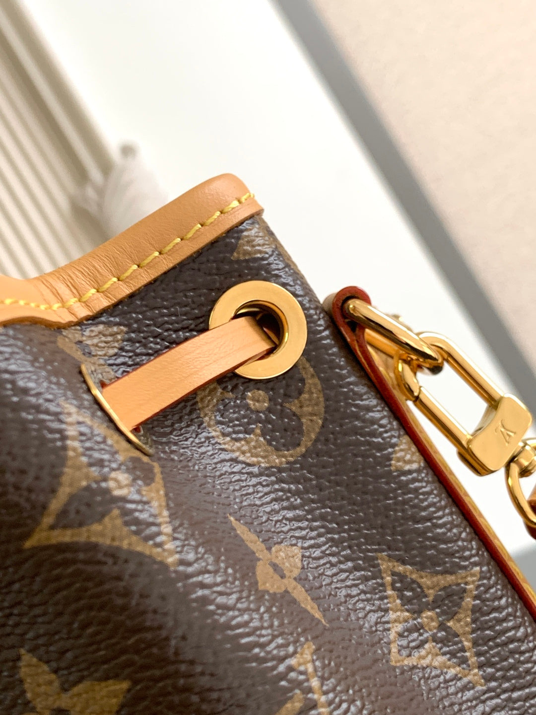 Louis Vuitton monogram bag D-ring with tan leather tab and gold-tone clip