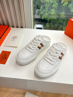 White Hermes sneakers for ladies with brown H logo, front top view