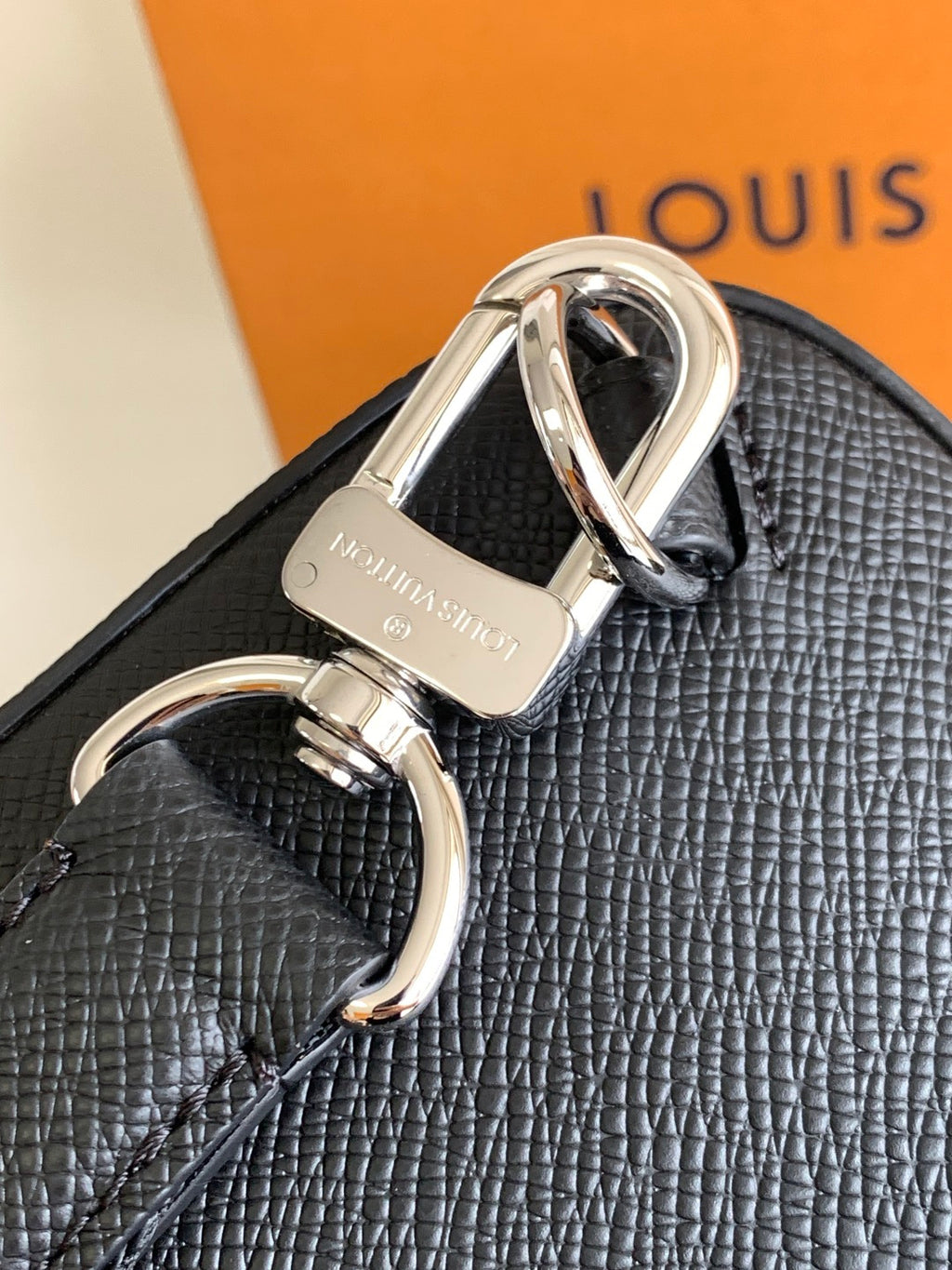 Louis Vuitton black textured leather bag with metal D-ring hardware