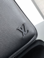 Louis Vuitton black leather corner with embossed logo and stitched edge