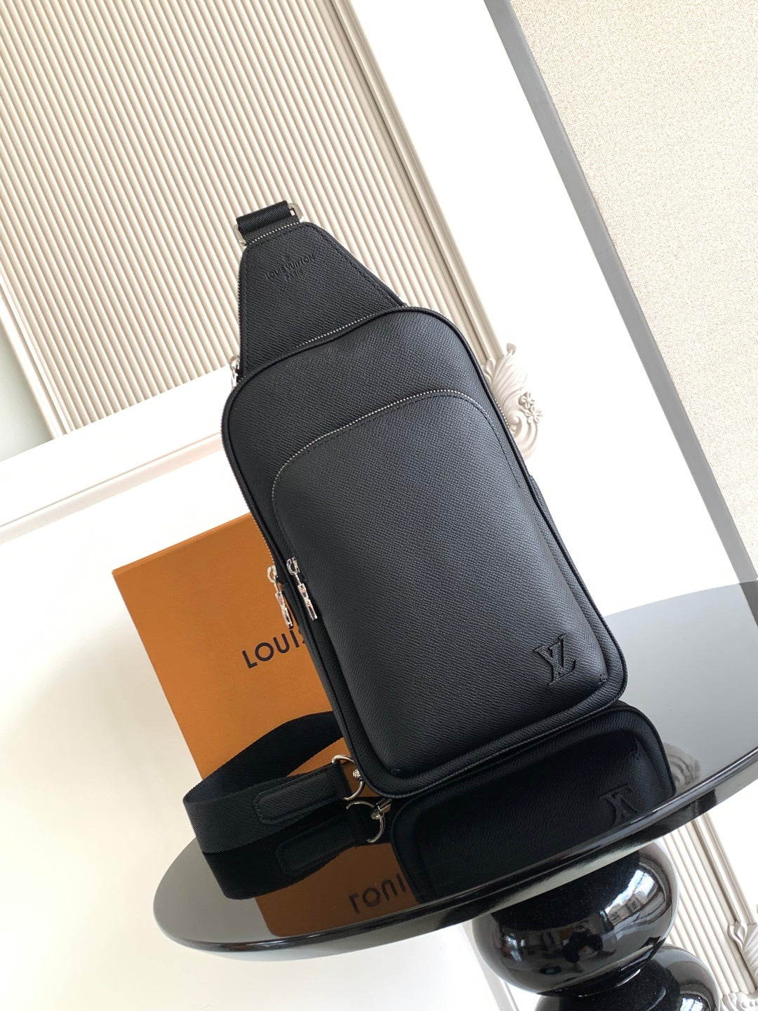 Louis Vuitton black leather crossbody bag with top flap and strap