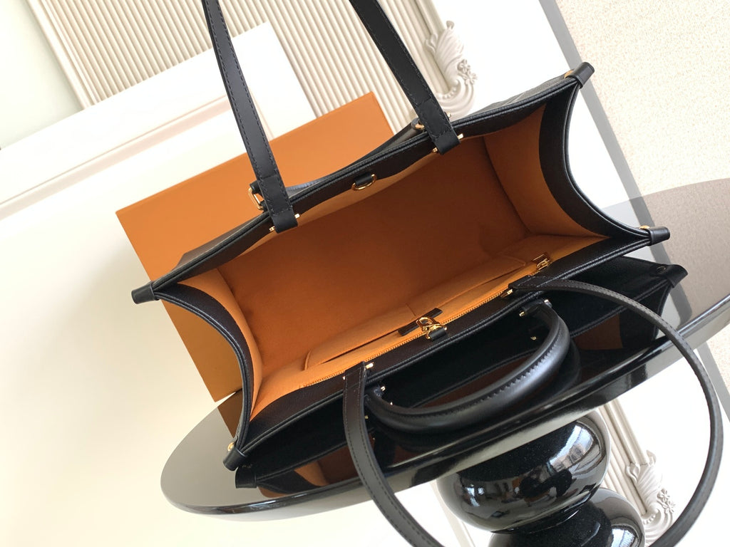 Louis Vuitton tote bag open view showing tan interior lining and top handles
