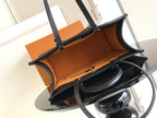 Louis Vuitton tote bag open view showing tan interior lining and top handles