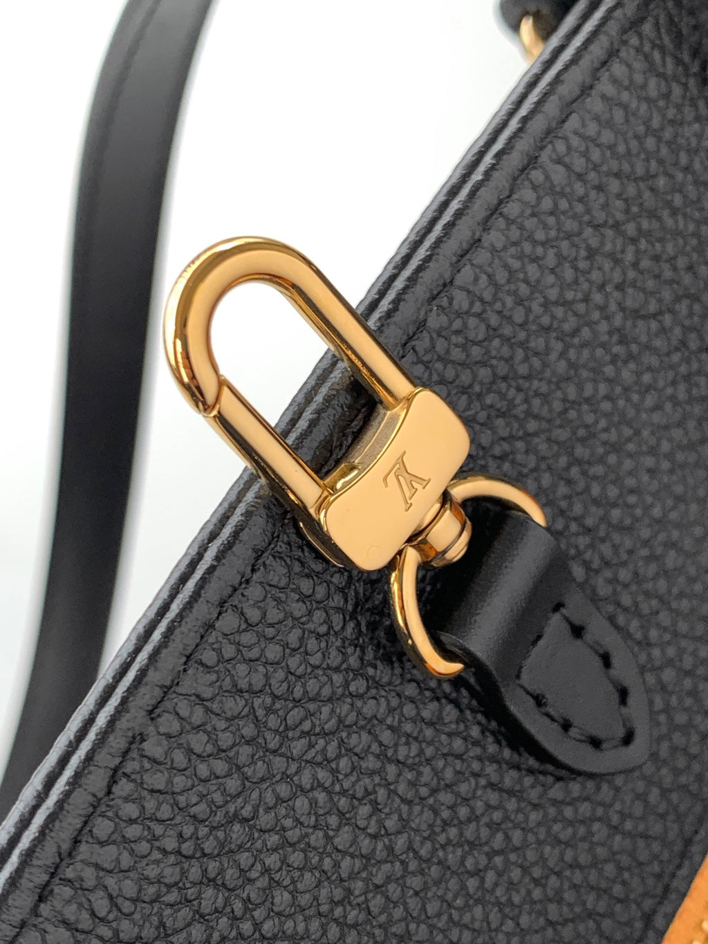 Louis Vuitton tote bag gold-tone D-ring clasp on dark leather strap
