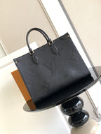 Louis Vuitton embossed tote bag with top handles and dark leather trim