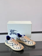 Burberry sneakers with beige plaid and blue collar, pair view on display box
