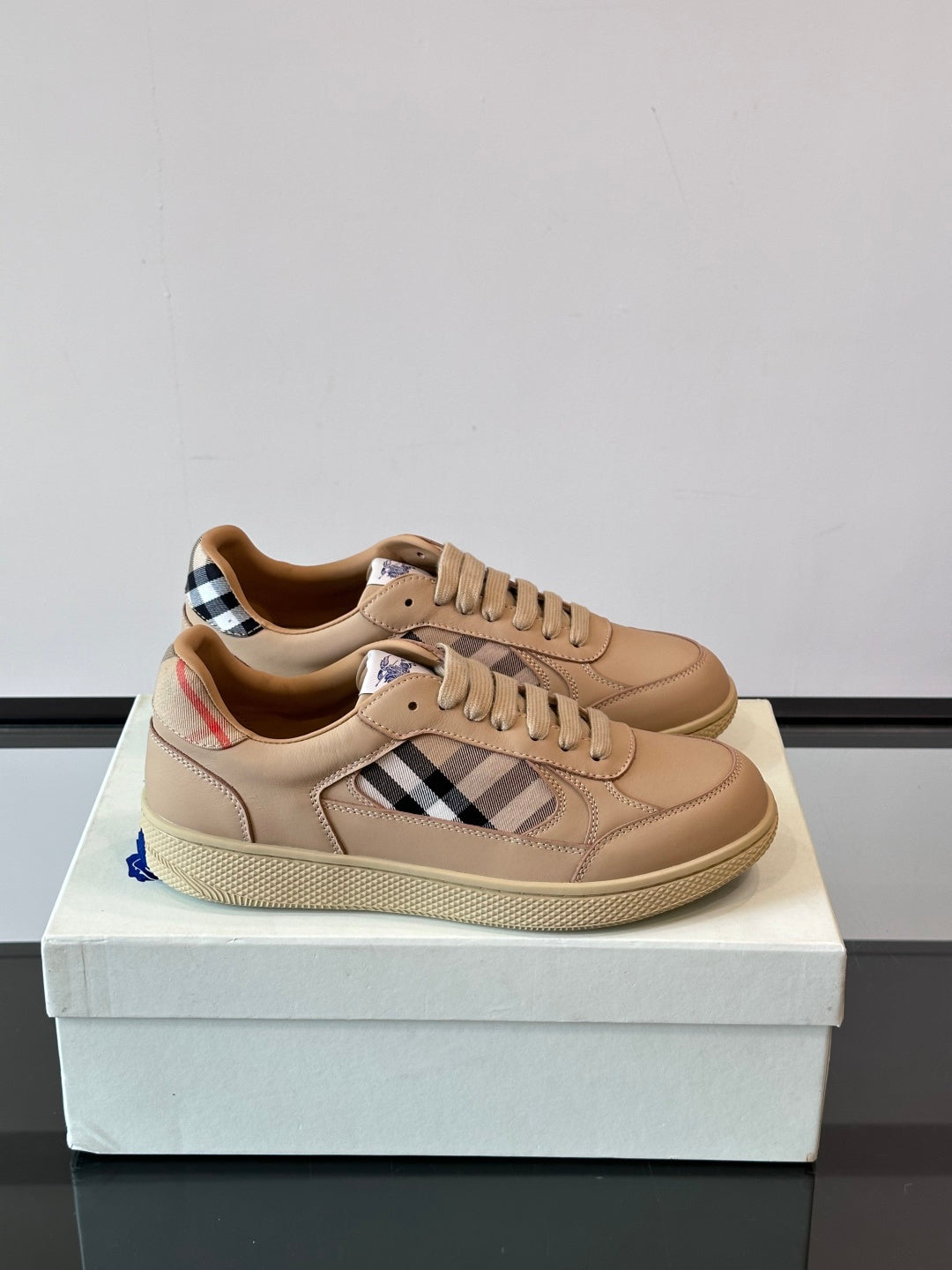 Sneakers with Burberry check panels, beige leather uppers and lace-up front