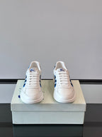 Burberry low-top sneakers, white with blue heel accents and lace-up