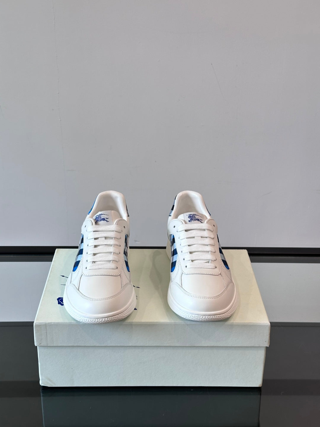 Burberry low-top sneakers, white with blue heel accents and lace-up