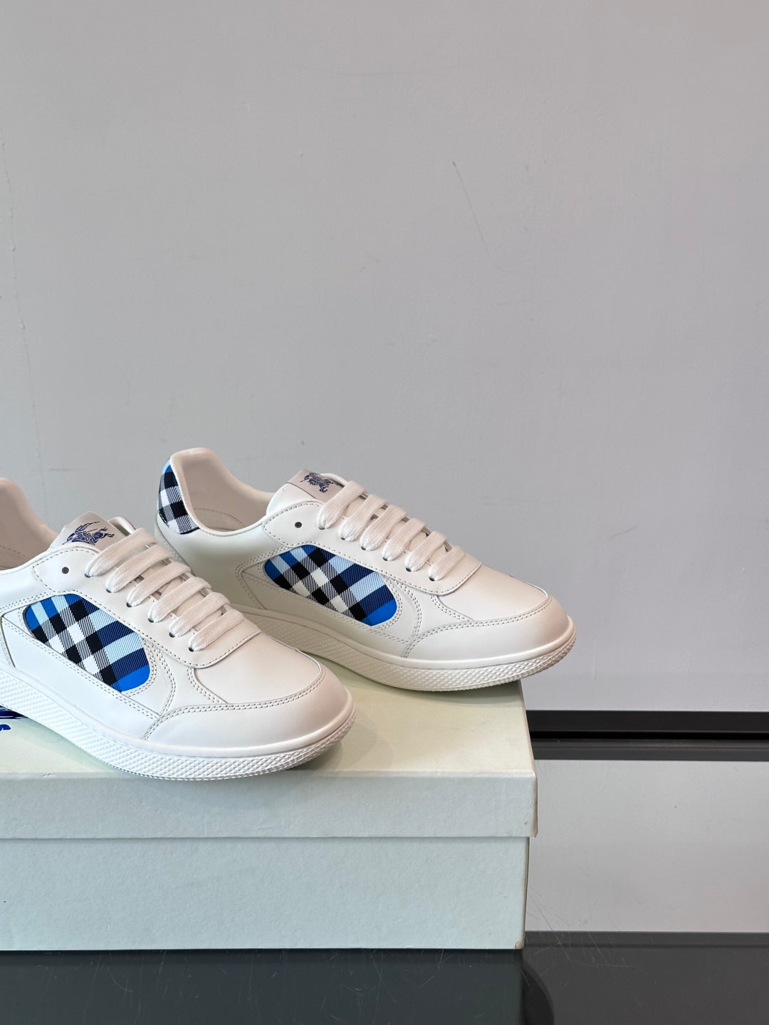 Burberry low-top sneakers, white with blue plaid quarter panels and lace-up