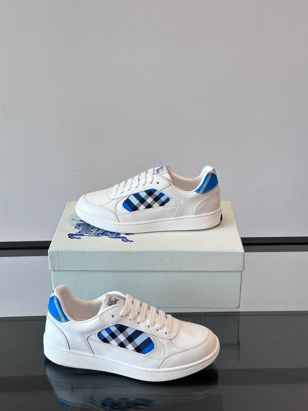 Burberry low-top sneakers, white with blue plaid logo detail and lace-up