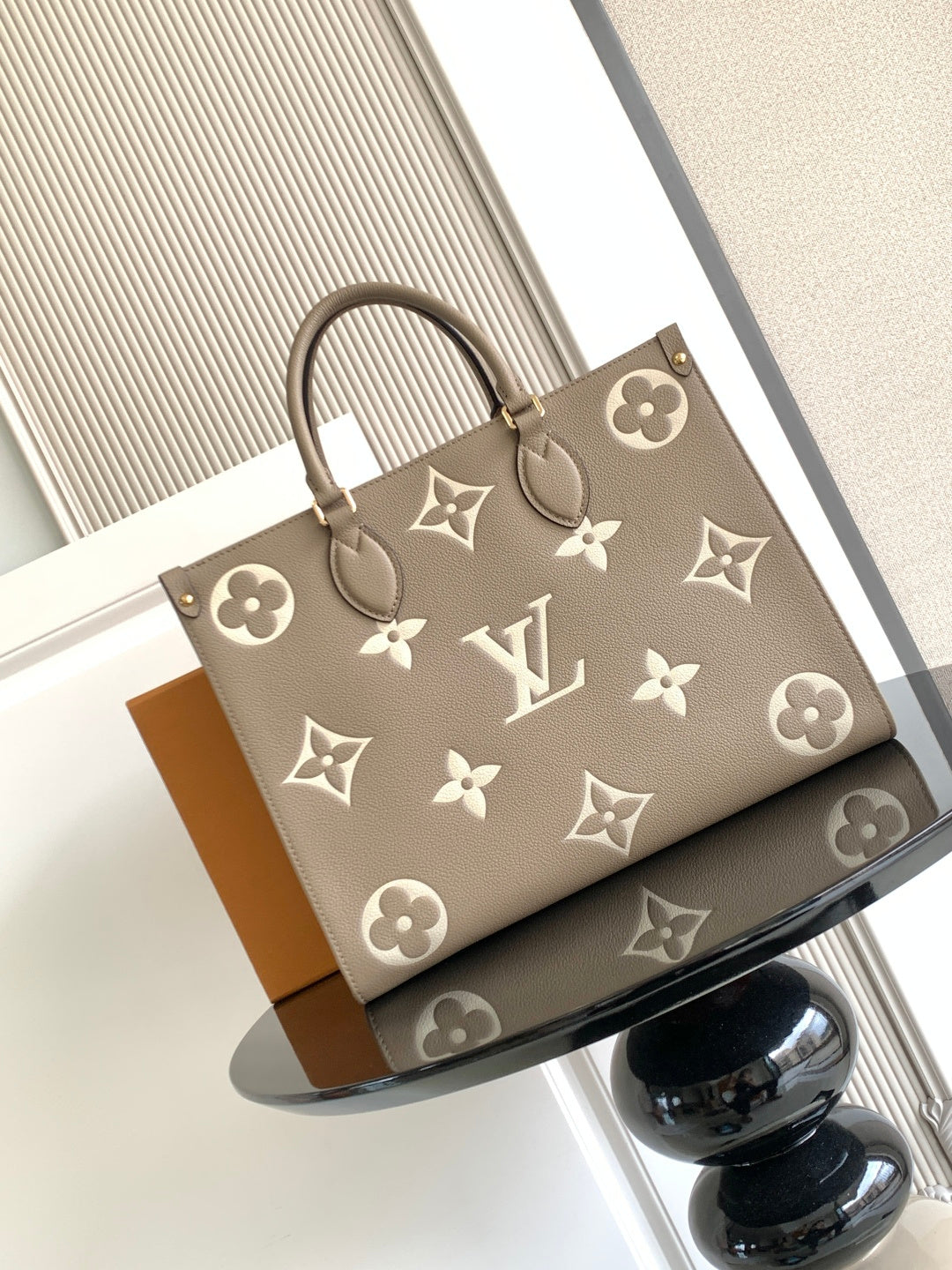 Louis Vuitton monogram tote bag in taupe with floral pattern and top handles