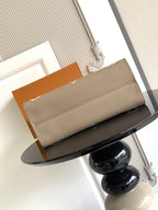 Louis Vuitton small leather bag in taupe with top fold-over flap