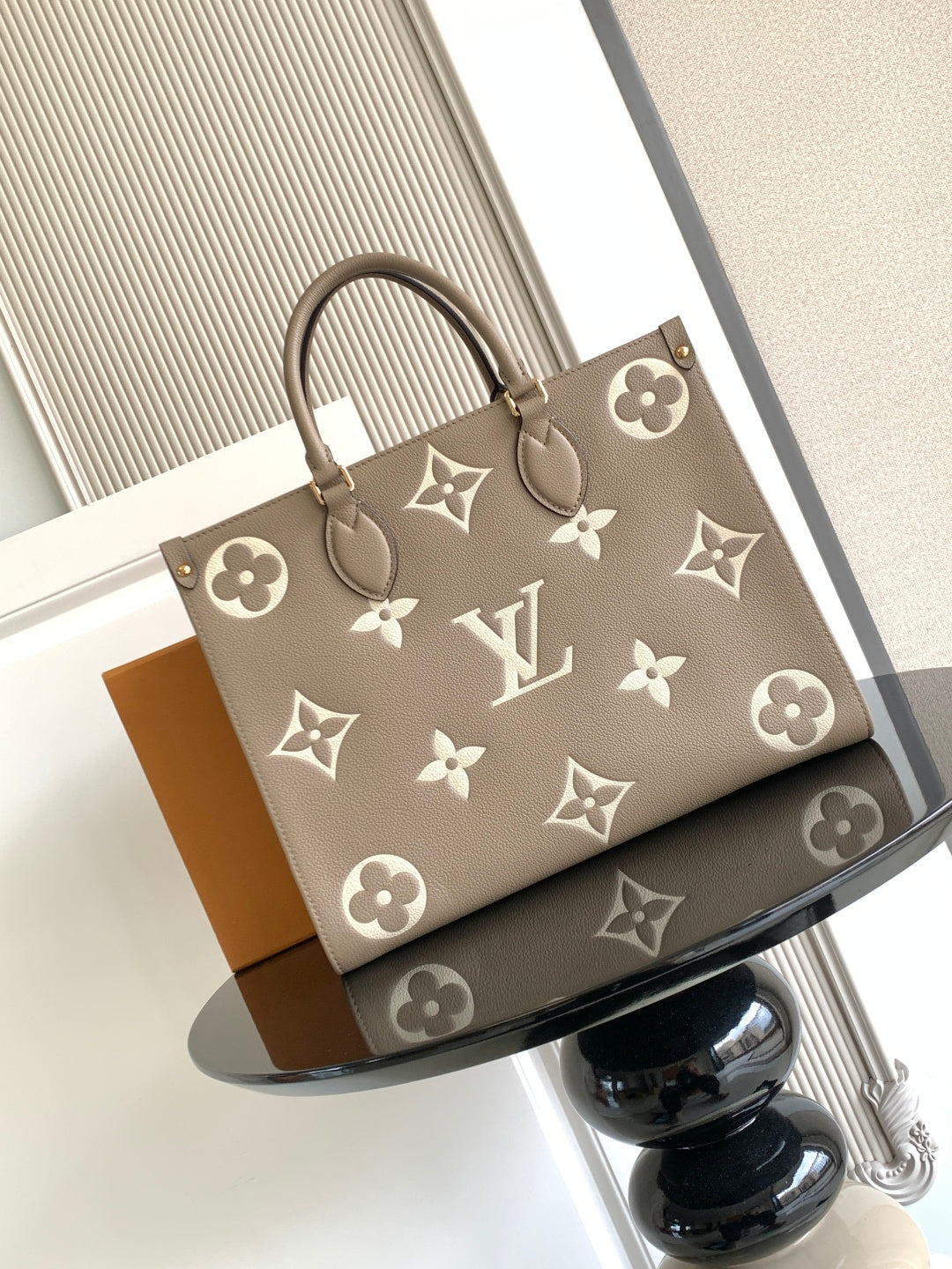 Louis Vuitton monogram tote bag in taupe with patterned logo motifs and handles