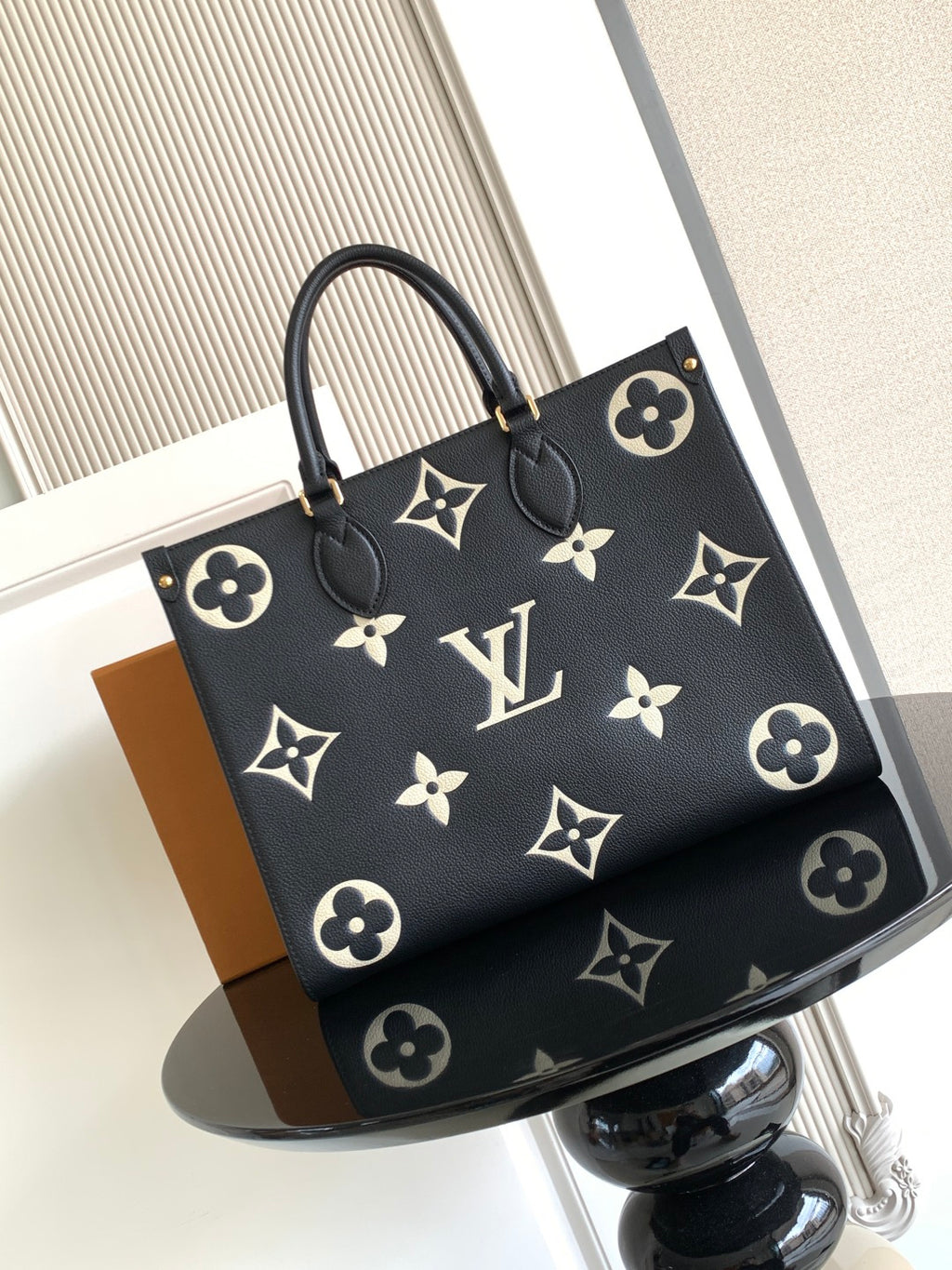 Louis Vuitton tote bag in dark canvas with monogram flower pattern and top handles
