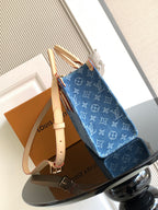 Louis Vuitton denim tote bag with adjustable shoulder strap and stacked handles