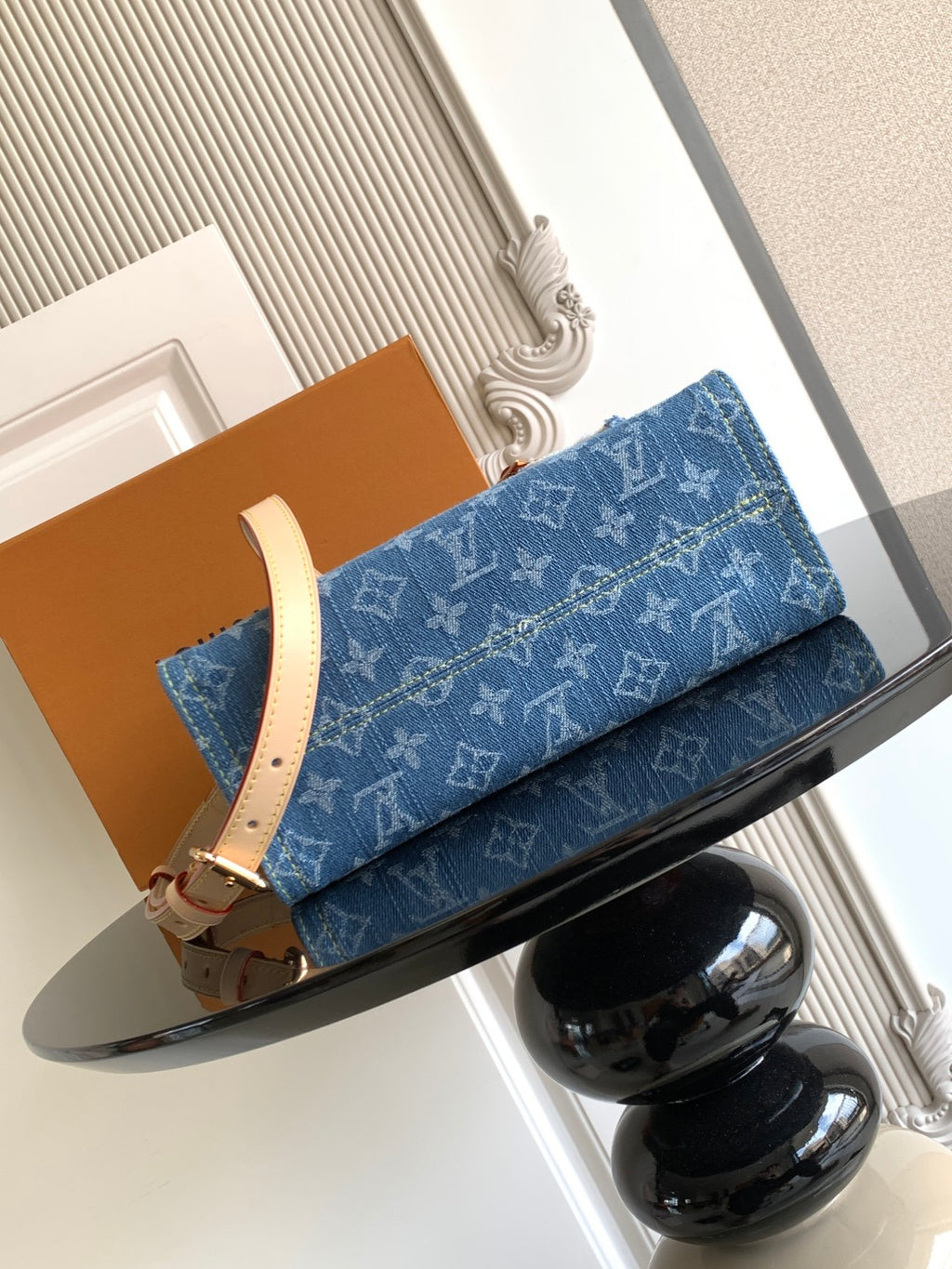 Louis Vuitton denim tote bag with tan leather crossbody strap and gold clasp