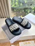 Women’s slide sandals, dark leather with patterned logo strap