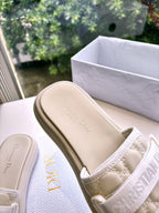 Dior ladies slide sandals footbed close-up in light beige with branding on insole