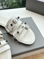 Balenciaga women's sandals, light cream, close-up of double straps and buckles