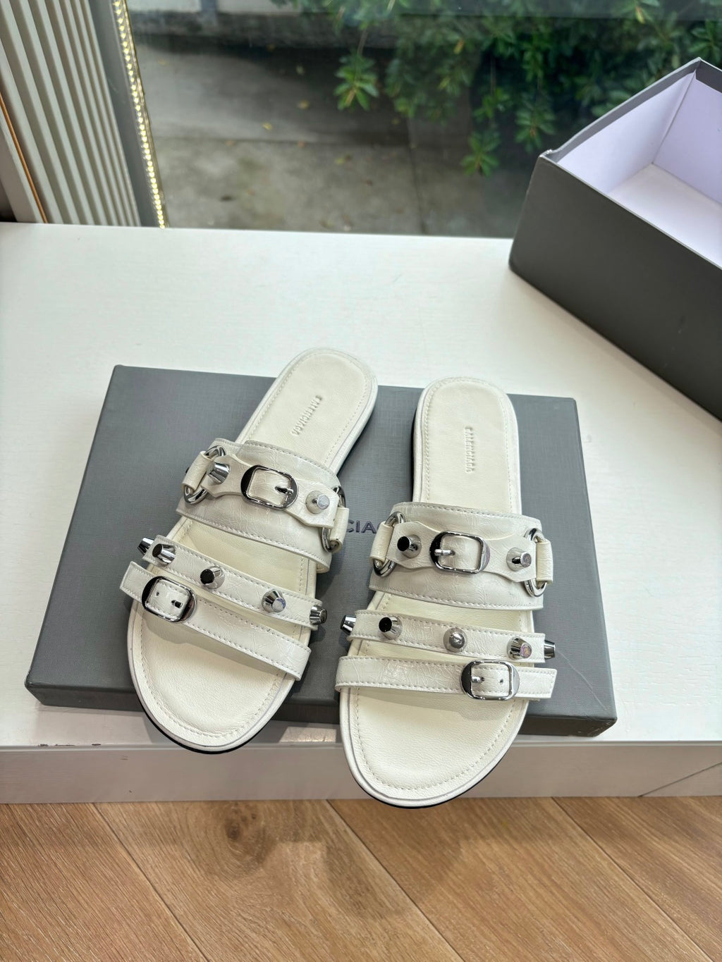 Balenciaga women's slide sandals in light cream with two wide buckle straps