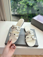 Balenciaga women's slide sandal in light cream with metal buckle strap detail