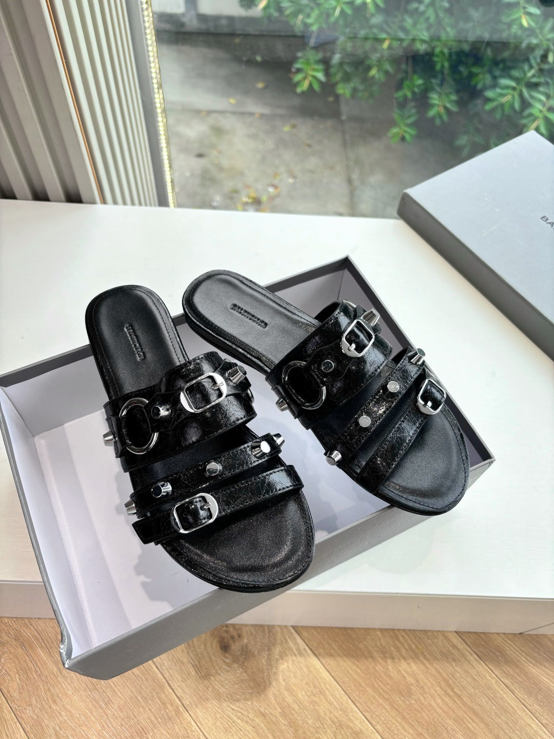 Balenciaga ladies black slide sandals with silver buckles and studded straps