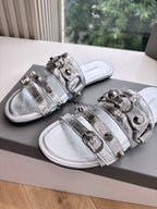 Balenciaga silver slide sandals with metallic double straps and buckles, pair view