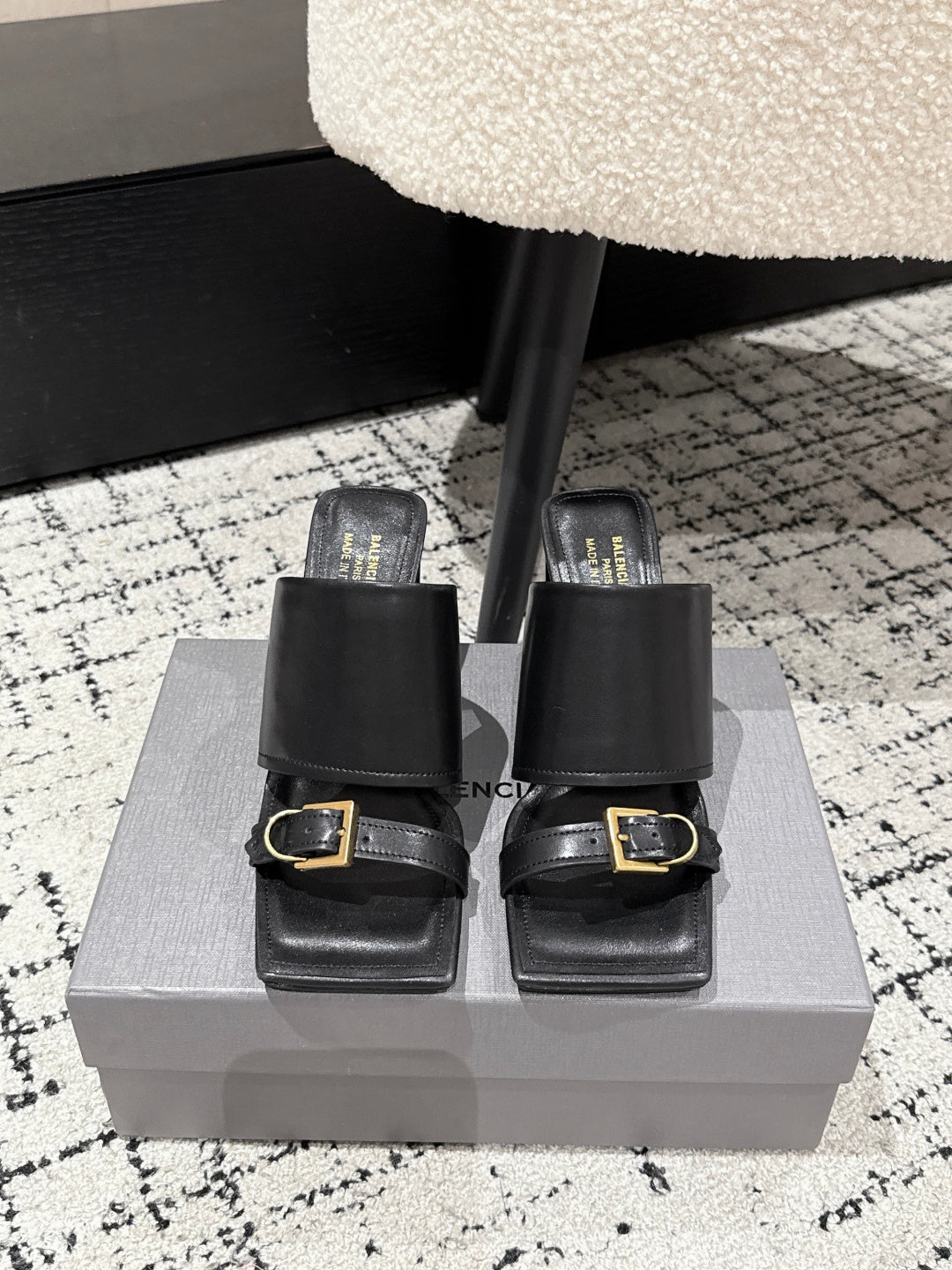 Black leather slide sandals with wide straps and gold buckle, block heel