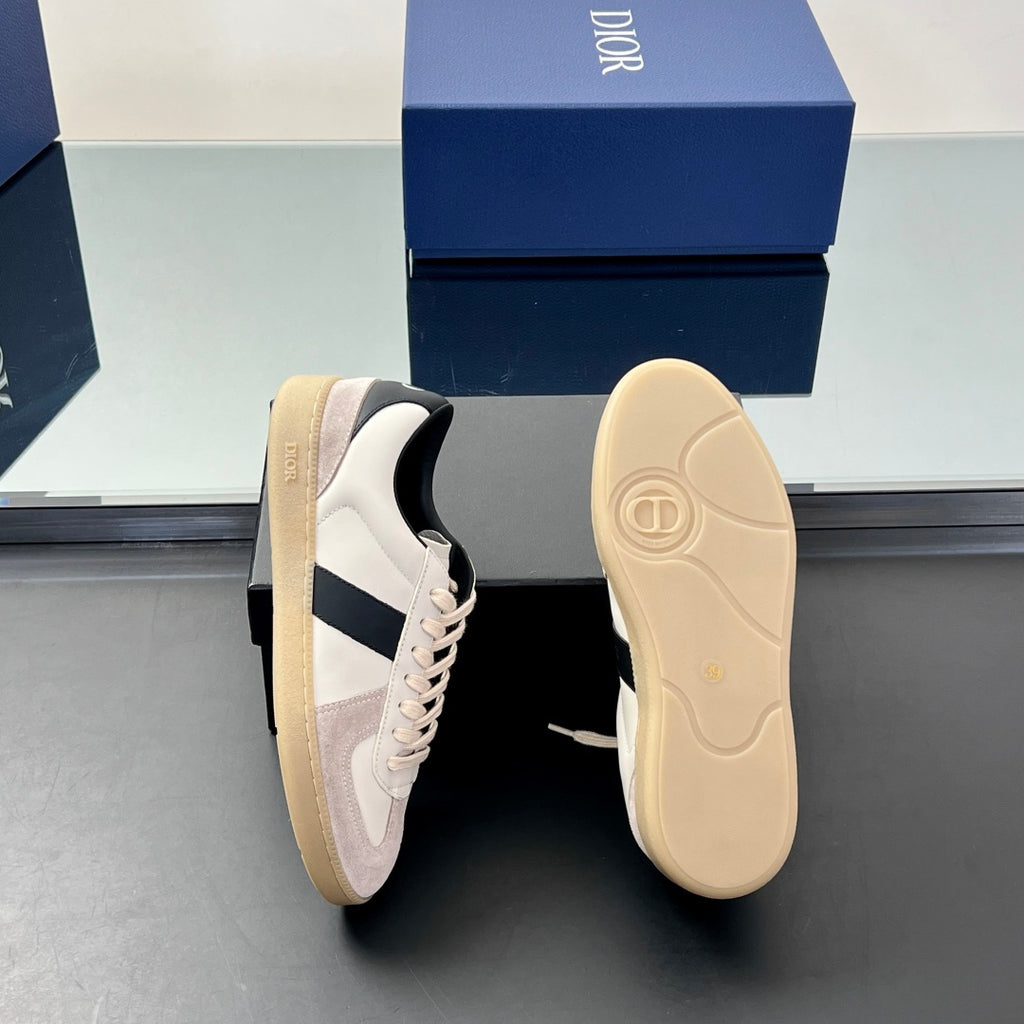Low-top sneakers shown side and sole view, with cream outsole and white upper