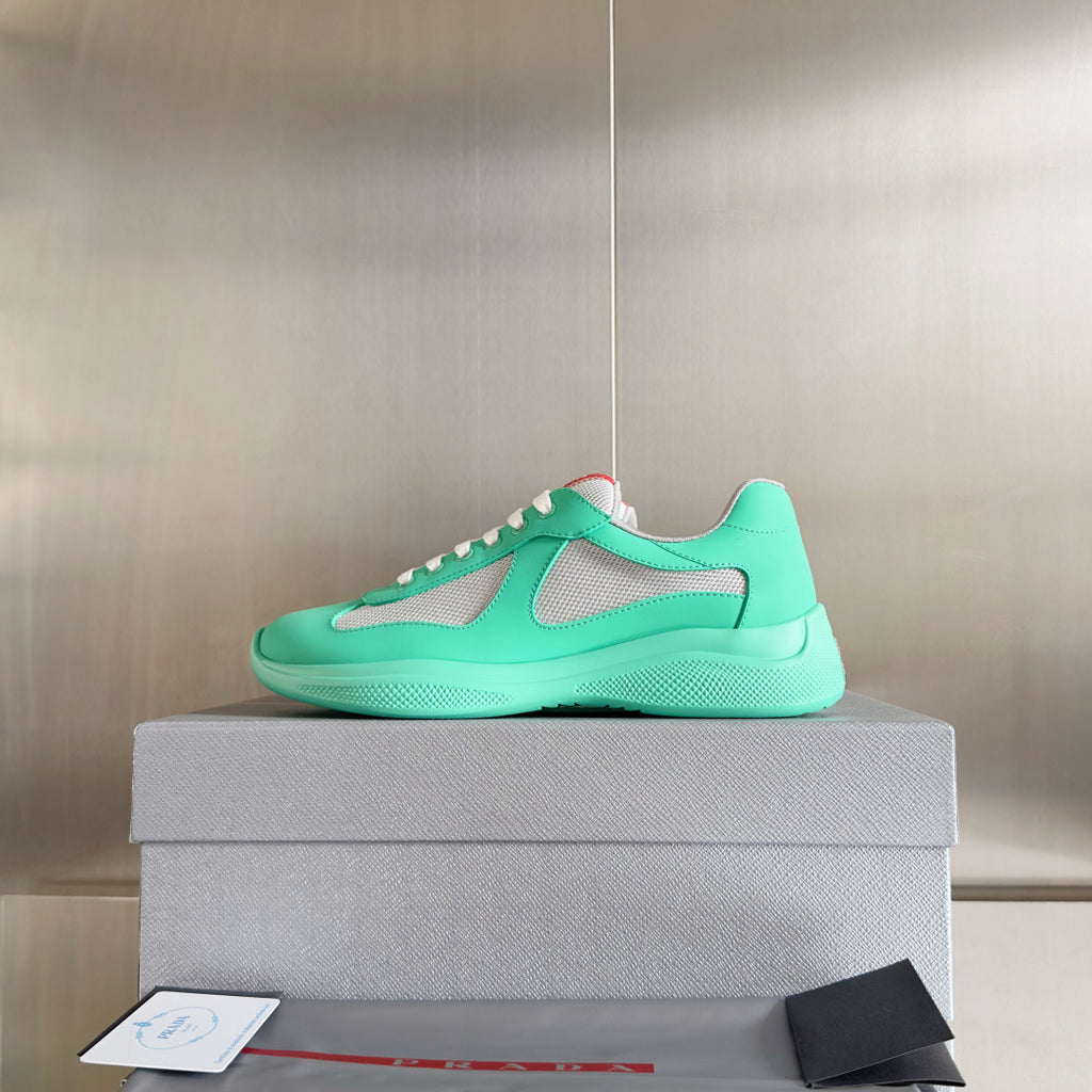 Prada unisex low-top sneakers in mint green with gray mesh uppers and white laces