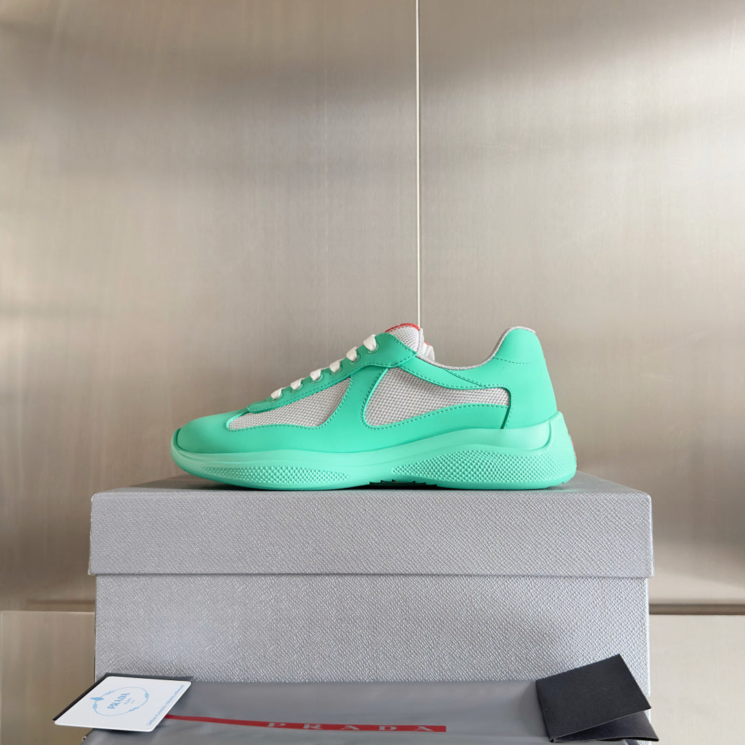 Prada unisex low-top sneakers in mint green with gray mesh uppers and white laces
