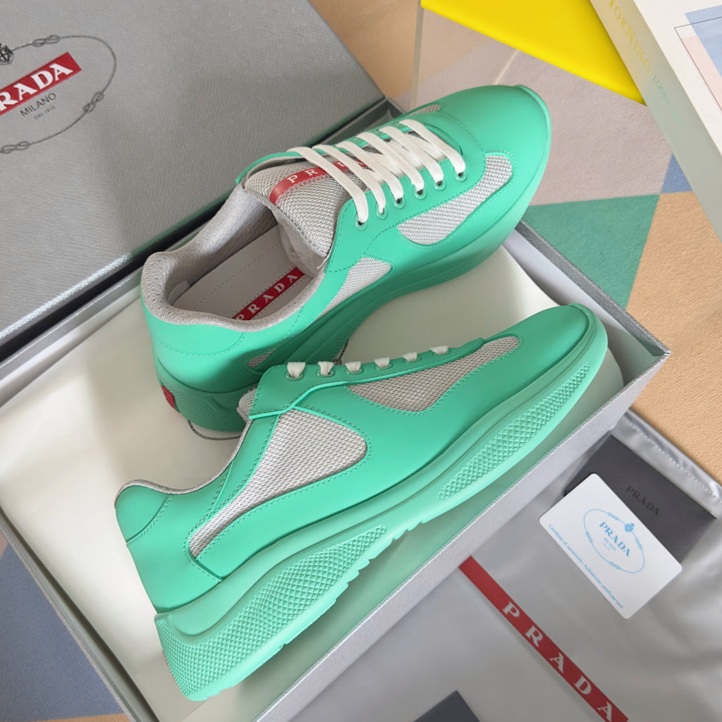 Prada unisex mint green sneakers with gray panels and white lace-up front, in box