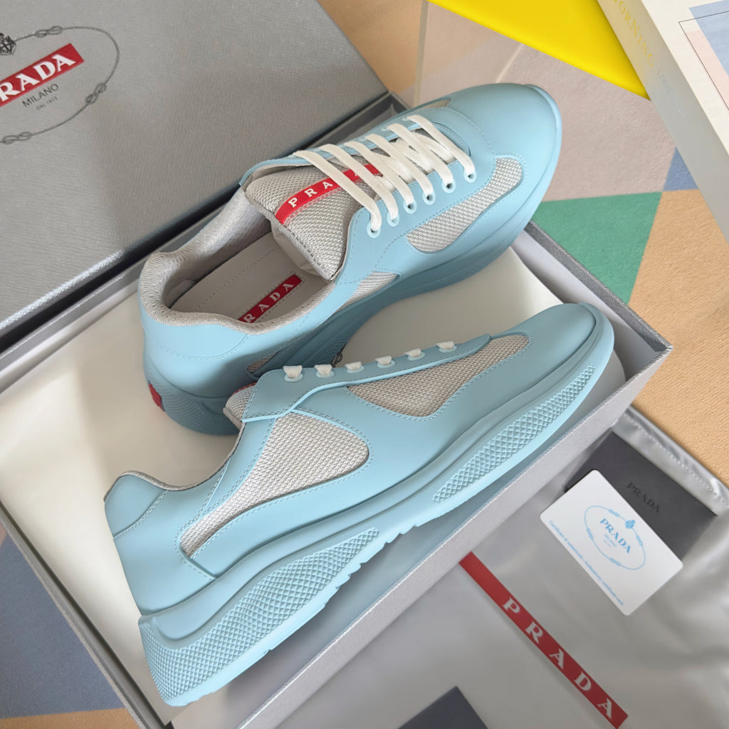 Prada unisex sneakers, light blue uppers with beige mesh panels, white laces and rubber sole