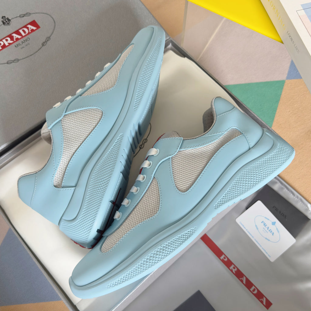 Prada unisex sneakers pair, light blue with beige inserts, mesh panels and thick sole