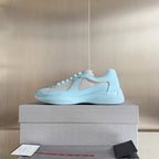 Prada unisex low-top sneakers, light blue upper with beige mesh detail and lace-up design