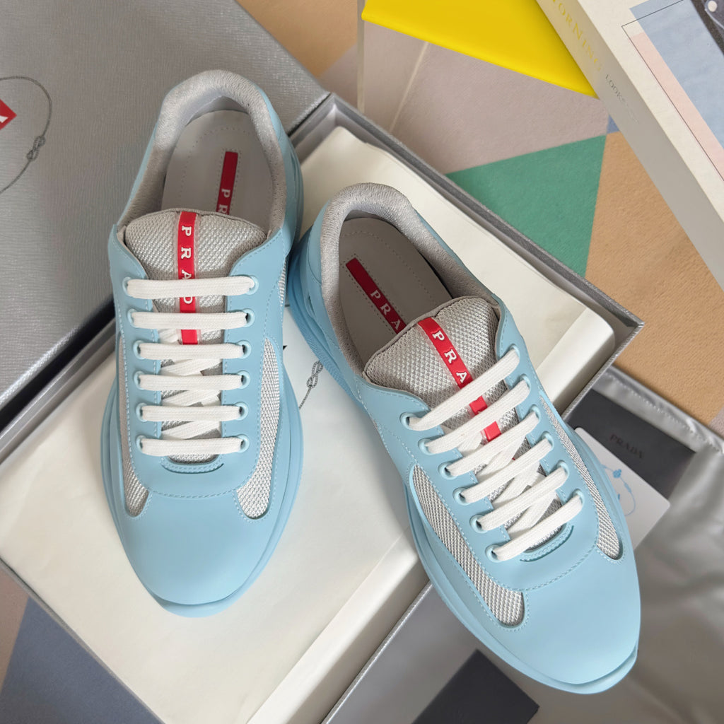 Prada unisex low-top sneakers, light blue with beige mesh panels and white laces