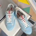 Prada unisex low-top sneakers, light blue with beige mesh panels and white laces