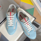 Prada unisex low-top sneakers, light blue with beige mesh panels and white laces