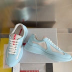 Prada unisex low-top sneakers, light blue with beige side panels and cushioned sole