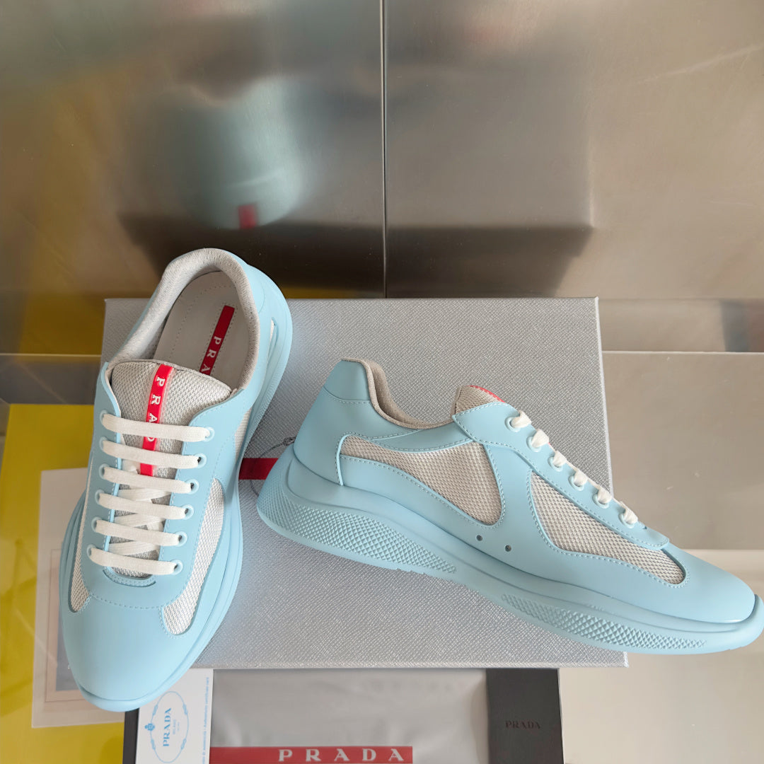 Prada unisex low-top sneakers, light blue with beige side panels and cushioned sole