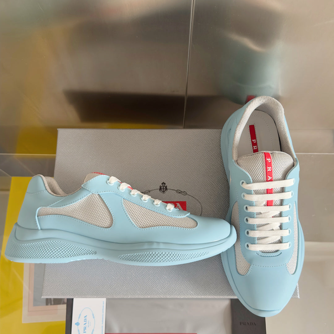 Prada unisex low-top sneakers, light blue leather with beige inserts and lace-up front