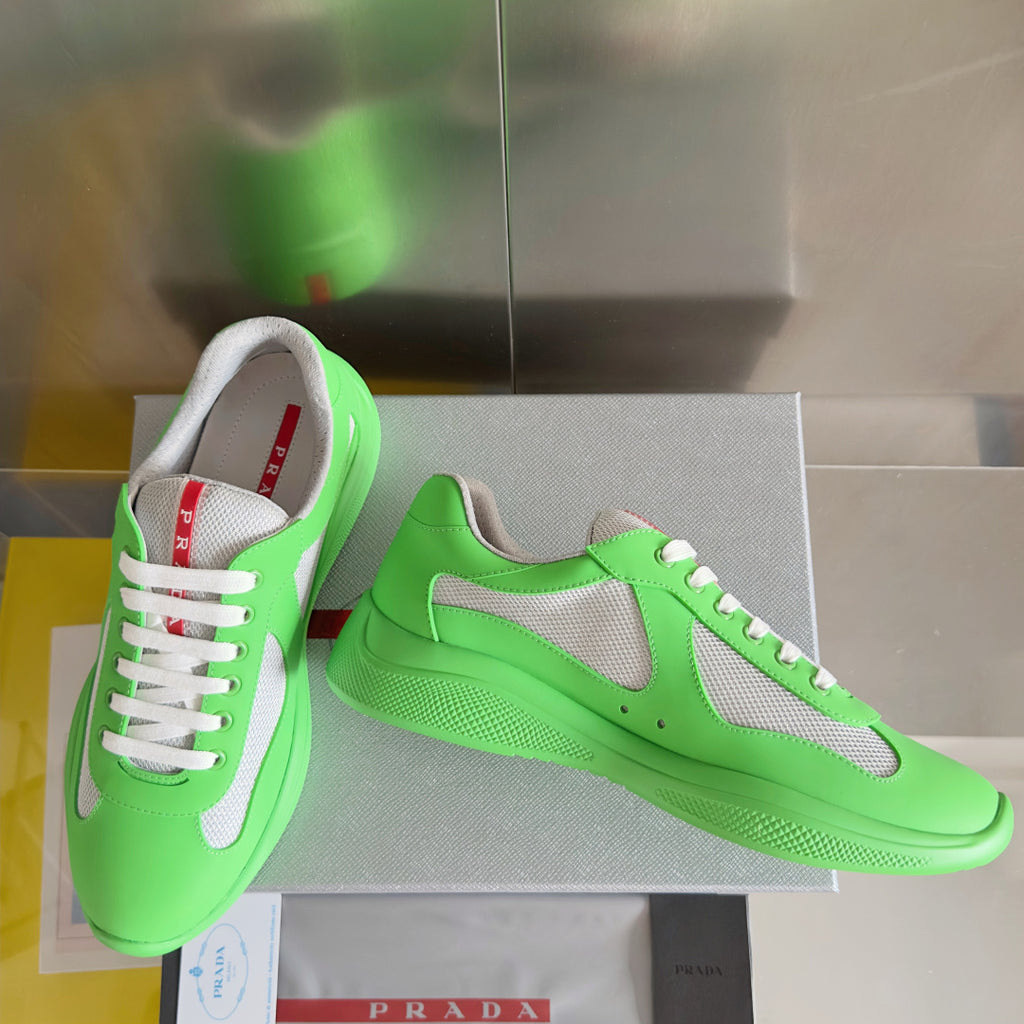 Prada unisex sneakers with neon green leather, gray side panel, and white lace-up