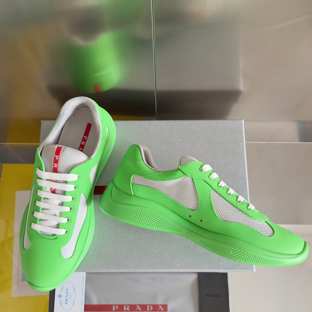 Prada unisex sneakers with neon green leather, gray side panel, and white lace-up